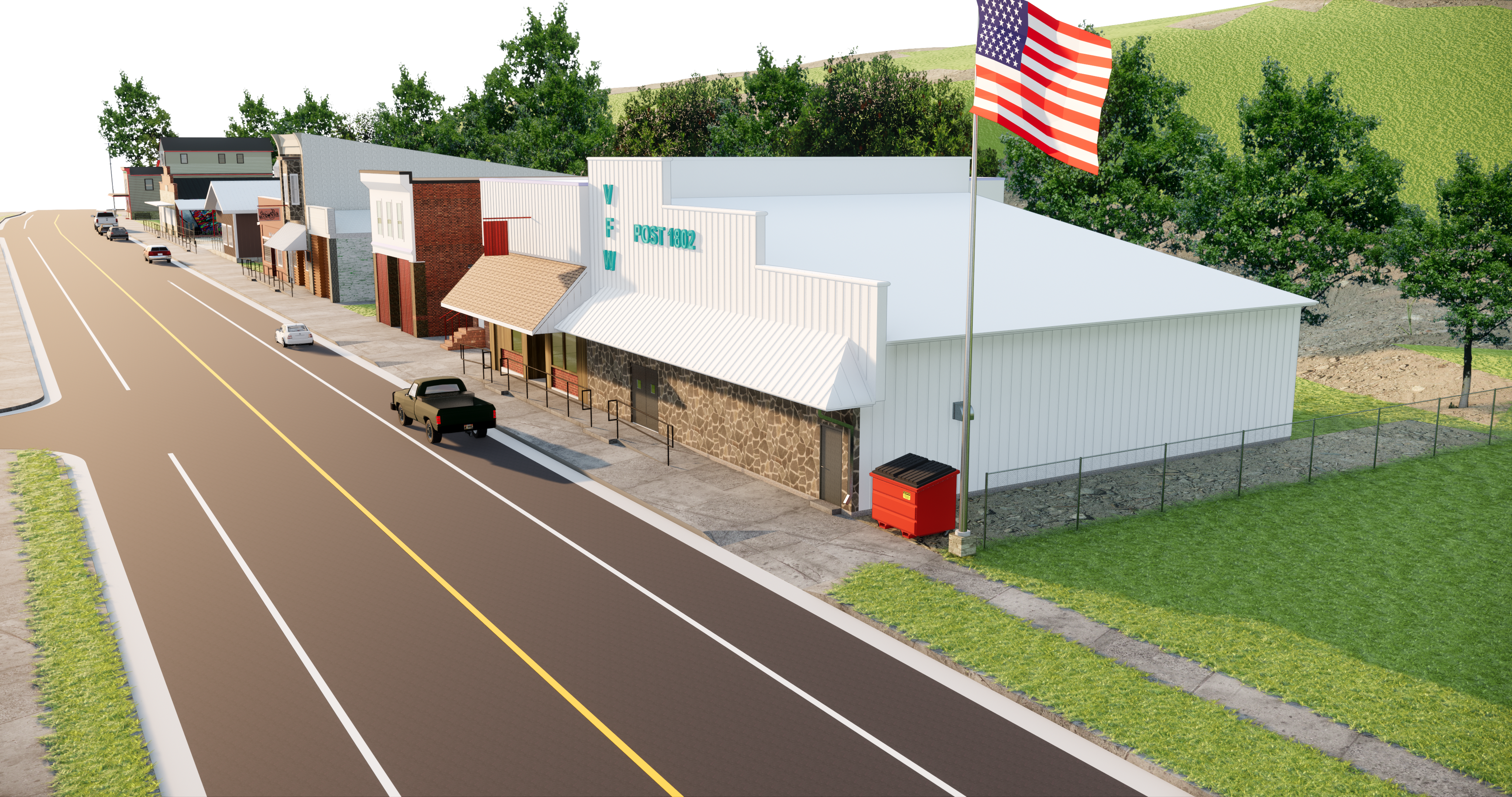 a highway street with buildings to the right. A white building with an american flag is in front.